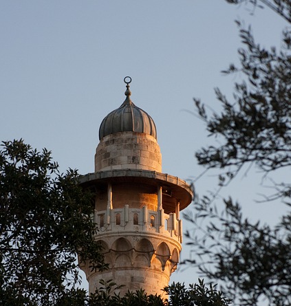 A picture of the Al-Ghawanima Minaret during sun set.